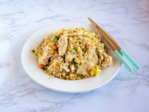 Chicken fried rice on a white plate